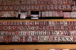 Letters are shown in a typecase for a printing press.